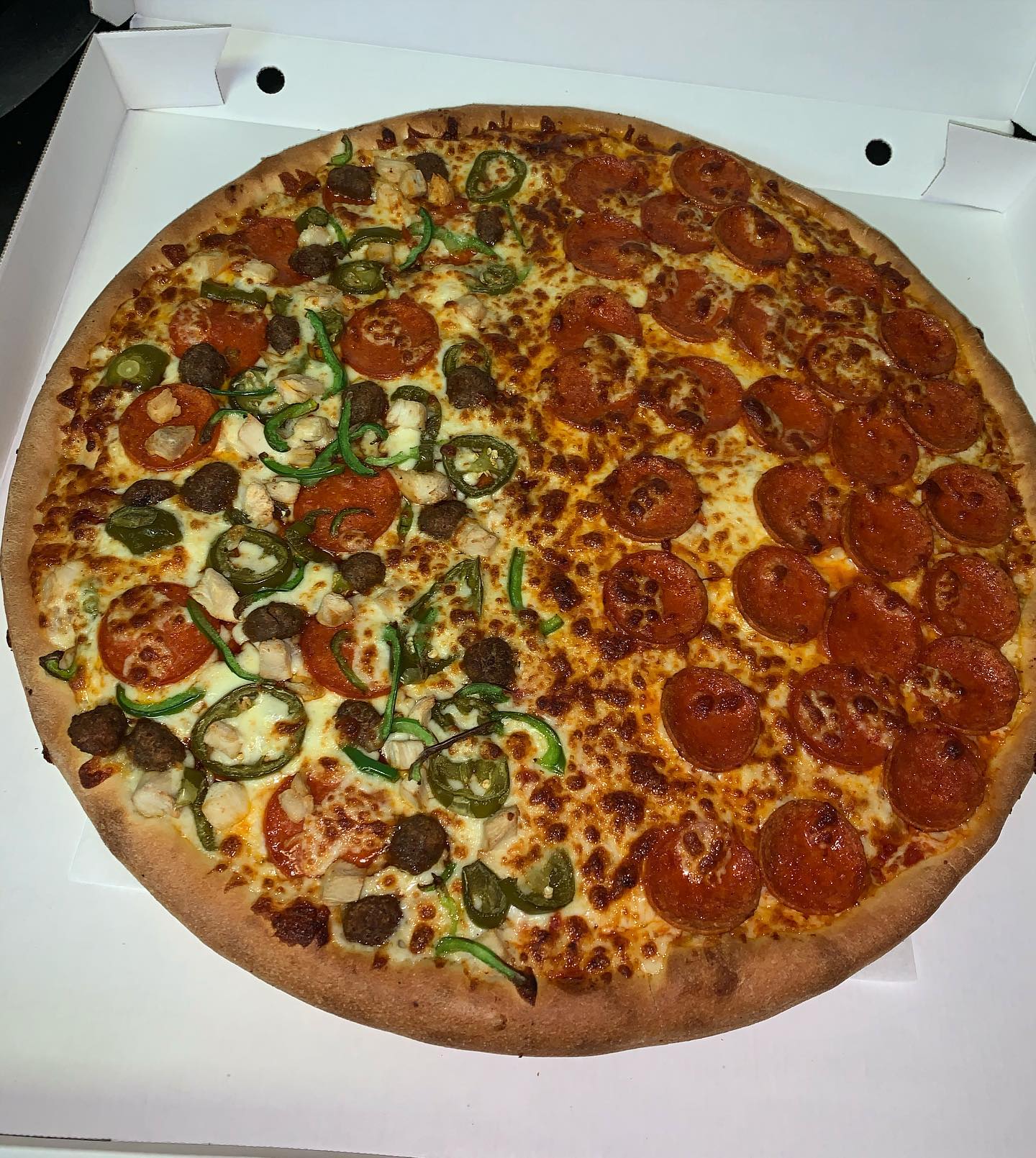 Loaded pizza with jalapenos and pepperoni