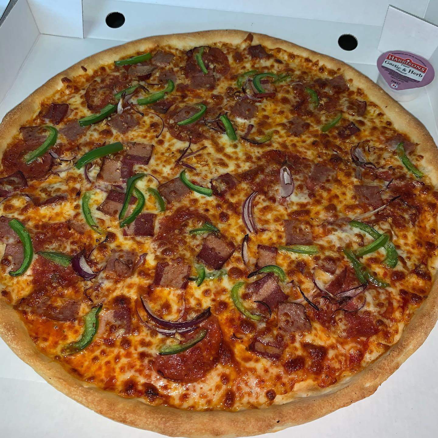 Meaty loaded pizza fresh from the oven